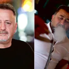 Man röker vattenpipa på ett mysigt vattenpipa cafe.